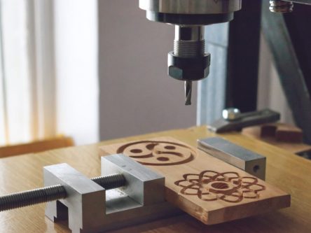 wood cutting machine 3D wood cnc router. CNC milling machine carving a wooden part blank. Cutter